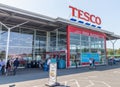 Newtown -  Wales / UK - July 23rd 2019 - Shoppers outside Tesco supermarket entrance Royalty Free Stock Photo