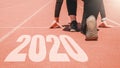 2020 Newyear , Athlete Woman starting on line for start running with number 2020 Start to new year Royalty Free Stock Photo