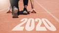 2020 Newyear , Athlete Woman starting on line for start running with number 2020 Start to new year Royalty Free Stock Photo