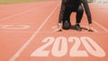 2020 Newyear , Athlete Woman starting on line for start running with number 2020 Start to new year Royalty Free Stock Photo