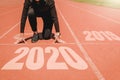2020 Newyear , Athlete Woman starting on line for start running with number 2020 Start to new year Royalty Free Stock Photo