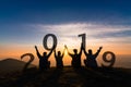 Newyear 2019 concept Silhouette of young friend jumping and hand Royalty Free Stock Photo