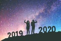 2020 Newyear  Couple celebration success of 2020 Happy new year background on  the Milky Way galaxy Royalty Free Stock Photo