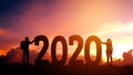 2020 Newyear Couple tries to push number of 2020 Happy new year concept
