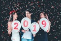 Newyear party ,celebration party group of asian young people holding balloon numbers 2019 happy and funny concept Royalty Free Stock Photo