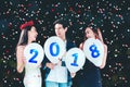 Newyear party ,celebration party group of asian young people holding balloon numbers 2018 happy and funny concept Royalty Free Stock Photo