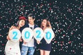 2020 Newyear party ,celebration party group of asian young people holding balloon numbers 2020 happy and funny concept