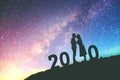 2020 Newyear Silhouette young couple Happy for romantic background on the Milky Way galaxy pointing on a bright star Royalty Free Stock Photo