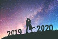 2020 Newyear Silhouette young couple Happy for romantic background on the Milky Way galaxy pointing on a bright star Royalty Free Stock Photo