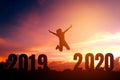 2020 Newyear Silhouette young woman jumping to Happy new year concept Royalty Free Stock Photo