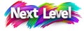 Next level paper word sign with colorful spectrum paint brush strokes over white Royalty Free Stock Photo