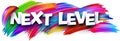 Next level paper word sign with colorful spectrum paint brush strokes over white Royalty Free Stock Photo