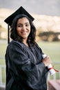 The next mission is to make a success of my career. Portrait of a student holding her diploma on graduation day. Royalty Free Stock Photo