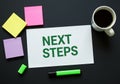 next steps planning workspace with notes coffee and marker Royalty Free Stock Photo