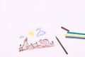 Next to the markers is a primitive children`s drawing with a felt-tip pen on a white background. child development Royalty Free Stock Photo