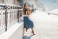 Fashion lifestyle portrait of young happy pretty woman laughing and having fun on the street at nice sunny summer day Royalty Free Stock Photo