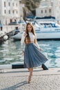 Fashion lifestyle portrait of young happy pretty woman laughing and having fun on the street at nice sunny summer day Royalty Free Stock Photo