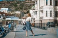 Fashion lifestyle portrait of young happy pretty woman laughing and having fun on the street at nice sunny summer day Royalty Free Stock Photo