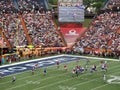 NFC Quarterback Drew Brees throws ball towards end zone with other All-star Players in motion during play and ball seen flying in