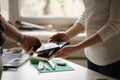 NFC technology. Customer is paying. Close up of guest using smart phone while making contactless payment in a pub. Royalty Free Stock Photo