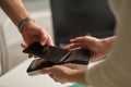 NFC technology. Customer is paying. Close up of guest using smart phone while making contactless payment in a pub. Royalty Free Stock Photo