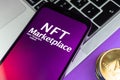 NFT cryptoart marketplace concept. Mobile phone for working with non-fungible token. Future of crypto currency