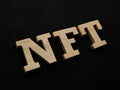 NFT Non Fungible Token, text words typography written with wooden letter, future digital asset