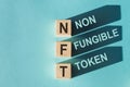 NFT non-fungible token word blocks. Selling digital assets and art through auctions