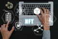 NFT token digital crypto art blockchain technology concept, Person hand using smartphone and laptop computer with NFT icon on Royalty Free Stock Photo