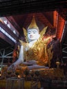 The Nga Htat Gyi Buddha image in Royal regalia wearing a golden robe