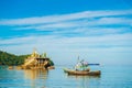 NGAPALI, MYANMAR - DECEMBER 5, 2016: Fishing boats on the beach. Copy space for text.