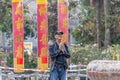 Ngong Ping, Hong Kong - Worshiper outside the Po Lin Monastery Royalty Free Stock Photo