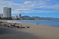 Large white umbrellas along Nha Trang long, curving stretch beach