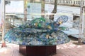 Nha Trang City, Vietnam - Oct 18, 2021: A turtle made from plastic bottles and an iron frame sends a message to reduce plastic