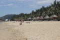 Nha trang, Viet nam - 13 July,2015: Beautiful landscape with visitors, umbrellas, coconuts, sand, blue sky on the beach