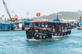 NHA TRANG, VIETNAM - APRIL 19, 2019: Boat with tourists and black old tires on board in the port for safety Royalty Free Stock Photo