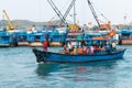 NHA TRANG, VIETNAM - APRIL 19, 2019: Boat with tourists and black old tires on board in the port for safety Royalty Free Stock Photo