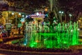 NHA TRANG, VIETNAM - APRIL 11, 2019: Green fountain in park near road in Nha Trang