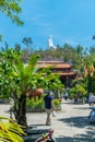 NHA TRANG, VIETNAM - APRIL 13, 2019: Long Son Pagoda in Nha Trang with statue of Buddha and tropical trees