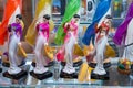 NHA TRANG, VIETNAM - APRIL 19, 2019: Multi-colored figures in the form of girls with hat on a shelf in a gift shop