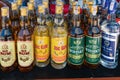 NHA TRANG, VIETNAM - APRIL 19, 2019: A row of different bottles of alcohol on a counter in a bar