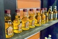 NHA TRANG, VIETNAM - APRIL 17, 2019: A row of small bottles of alcohol on the shelf in store Royalty Free Stock Photo