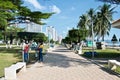 Nha Trang, Vietnam - February 4, 2019: Cityscape: tropical park on the coastline. Modern buildings and beautifully trimmed trees. Royalty Free Stock Photo