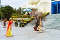 Vietnamese women posing for photos against many decorations in the square Nha Trang city with Lotus building, Tet Lunar New Year