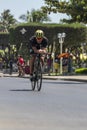 NHA TRANG, VIETNAM - JULY 14, 2019: Duc Anh Le a triathlon competitor in Challenge Vietnam rides a Bicycle along Tran Phu street