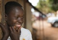 Portrait of a young african boy at the entrance of his home in the town of Nhacra in Guinea Bissau