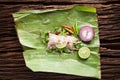 Nham sour pork in banana leaves thai food Royalty Free Stock Photo