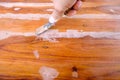 Putty knife on the wooden floor