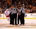 NHL Referees and linesmen at center ice.