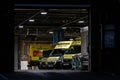 NHS Ambulance station with fleet of clean ambulances parked waiting for emergency incident response to accident and emergency Royalty Free Stock Photo